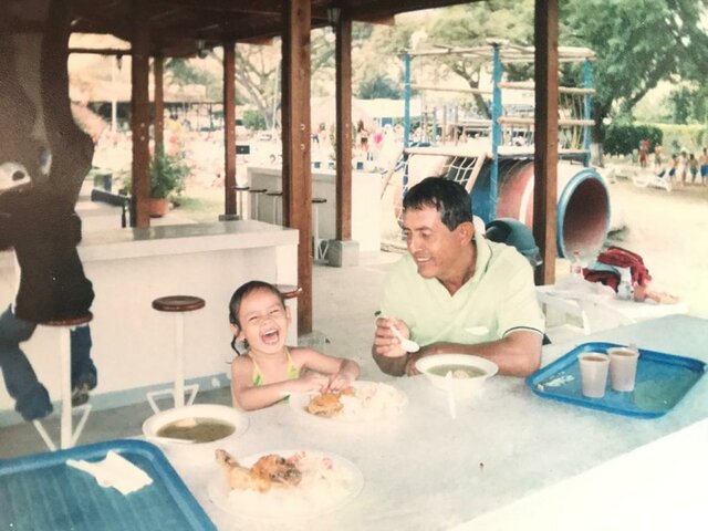 My mom took a picture of me and my dad while we laughed and had lunch.