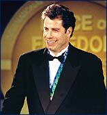 Presentation of IAS Freedom Medal to Scientologists John Travolta, Debbie Mace and Jerry Boswell