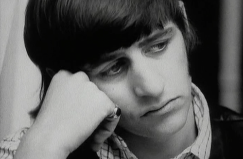 The Beatles break up as a group