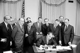 Signs Executive Order 12287