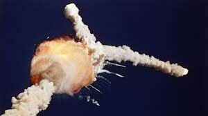 Space Shuttle Challenger explodes on takeoff,