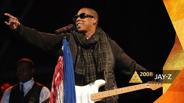 Jay-Z becomes the first rapper to headline Glastonbury, the largest greenfield music and performing arts festival in the world.