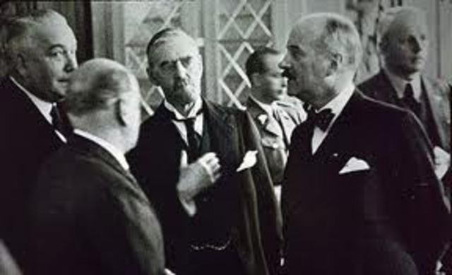 Britain’s Neville Chamberlain and Hitler meet at the Munich Conference.