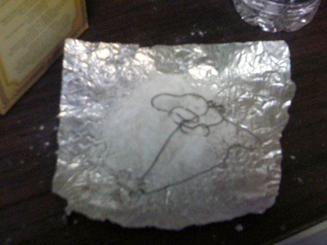 Place the jewelry on the aluminum foil