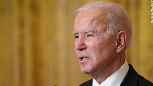 Biden marks 50 million vaccine doses but cautions there's a 'long way to go'