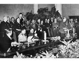 Germany, Italy, and Japan sign the Tripartite Pact.