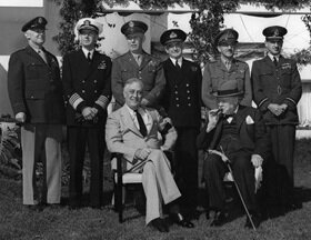 Roosevelt, Churchill, and the Combined Chiefs of Staff meet at Casablanca.