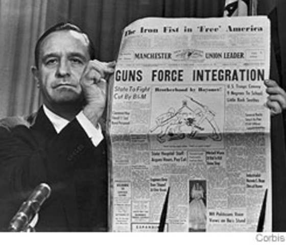 Governor Farbus of Arkansas brings in National Guard to prevent black students from going into a white school.