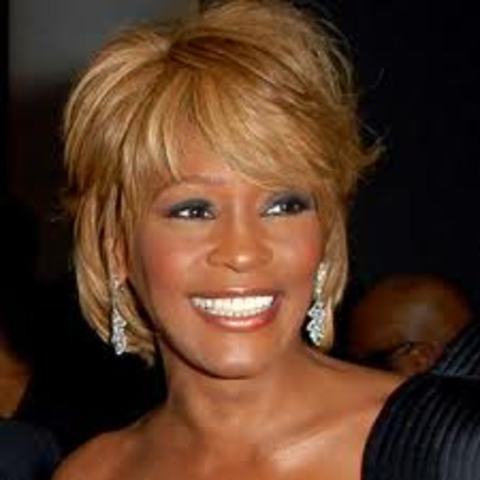 Whitney Houston releases her first self-titled album