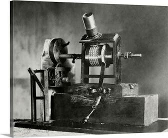 Invents the motion picture camera