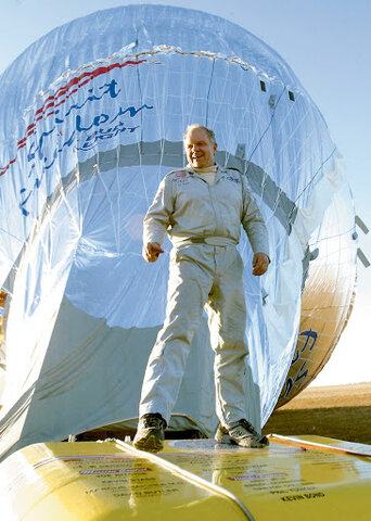 Steve Fossett circles the Globe in a balloon