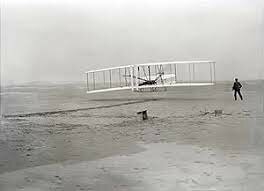 The Wright brothers make first powered flight