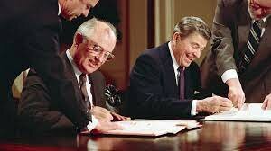 President Ronald Reagan signs a treaty With USSR