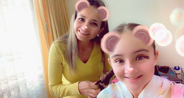 My mom combing my hair