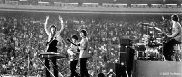 The Beatles play at Shea Stadium