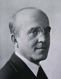 Frederick Griffith lleva a cabo el descubrimiento de la transformación bacteriana.