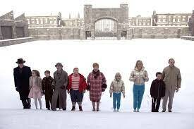 Outside the factory, with all the other kids and their parents and then meeting Willy Wonka