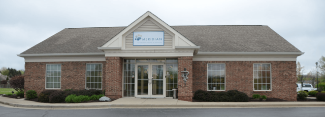 A pet owner holds a limp puppy while walking to the clinic. Maggie helps her grandmother with the clinic.