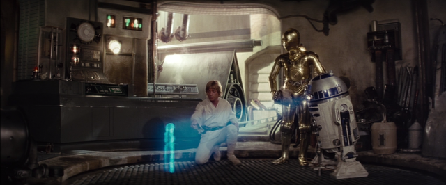 Luke is messing with R2, and Princess Leia's Message starts playing.