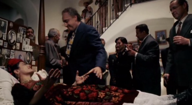 frida attends the gallery where they wait for her with a bed for her