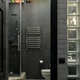 119830 stained glass ceiling in black tile wall and pebble floor bathroom