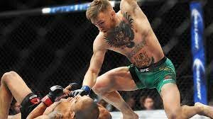 Conor McGregor wins the featherweight championship belt in 13 seconds