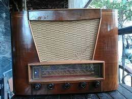 The first radio show is broadcast with music and speech.