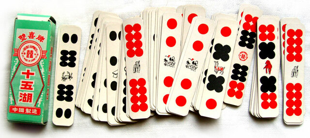 The Chinese Enjoy Games with Playing Cards and Dominoes