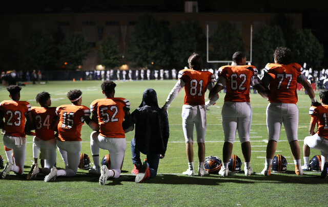 Following the protest of Colin Kaepernick, student athletes kneel during anthem, face reprisals