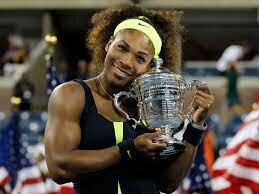 Serena receives a trophy for her win in the US Open tennis in NY