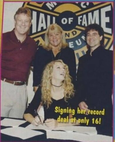 Taylor signed her first record deal