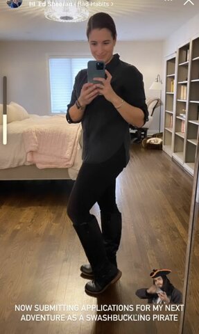 Posts a selfie to “show off her new boots”