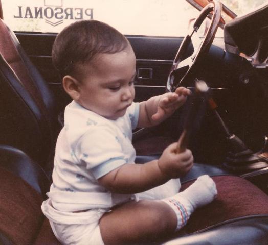 6MOTHS OLD PLAYING INSIDE DAD'S CAR