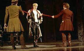 Claudius hires Rosencrantz and Guildenstern to spy on Hamlet