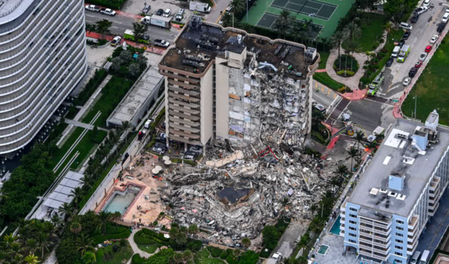 Debris is piled up after a 12 story building in Florida collapses, killing nearly 100 people.