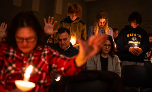 People of Oxford, Michigan attend a prayer vigil for the children who were killed during the school shooting. 4 were killed and 7 others were injured.