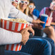 Stock photo partial view multiethnic friends popcorn