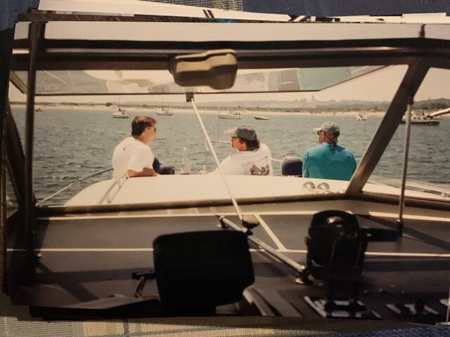 Sitting on the boat with son and friend