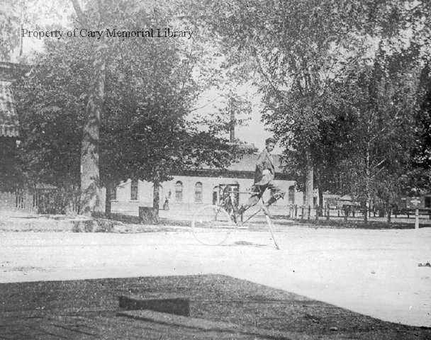 J. Chester Hutchinson doing bicycle tricks