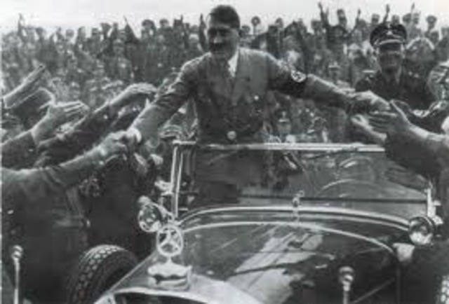 Hitler is greeted by the austrian Nazis