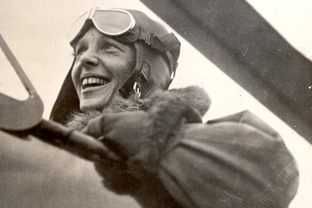 Amelia Earhart buys her first plane