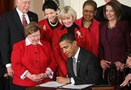 Barack Obama signs Lilly Ledbetter Fair Pay Act