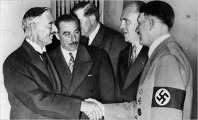 Chamberlain makes an agreement with Hitler to anex the Sudetenland