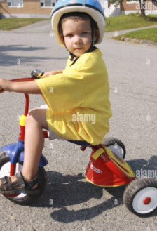 Anthony rides his tricycle!