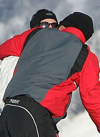 William is photographed kissing Kate for the first time publicly on a ski trip to Klosters