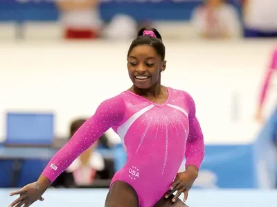 Become the first African-American woman to claim the all-around title