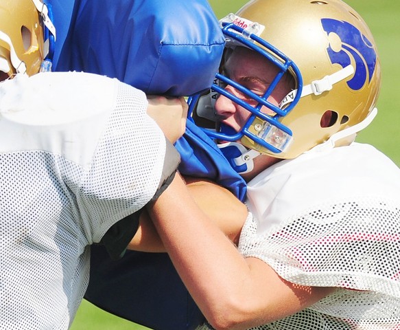 Russo attends and plays varsity football at Lake Mills High School