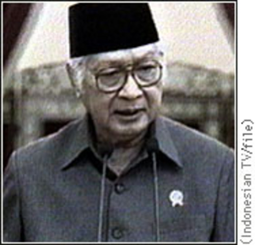 Suharto resigns