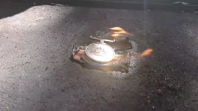 Veterans burn medals to protest Australia's 'failure' to protect Afghan translators from the Taliban