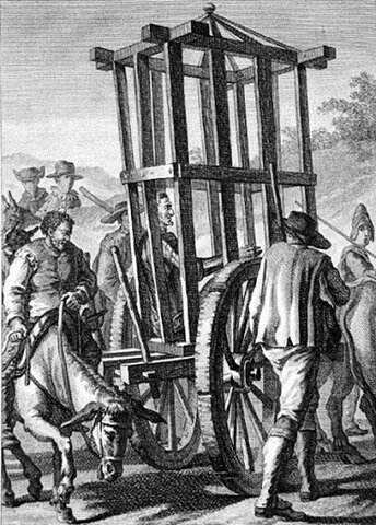 Encierran a don Quijote en una jaula.